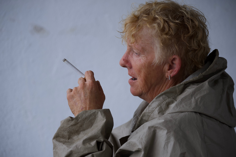 Deb Linn takes a drag from her cigarette